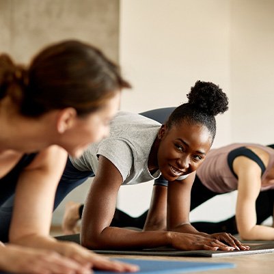 Group of women smiling during workout class