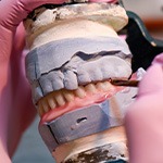 Dentures can be made of a variety of materials including acrylic or nylon