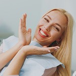 A woman smiling at the dentist