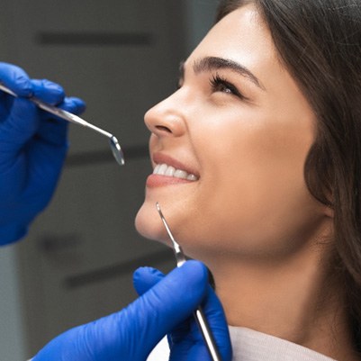 patient smiling while looking at dentist  