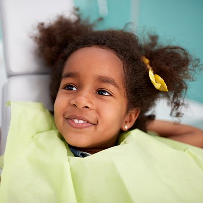 Young girl smiling at children's dentistry appointment