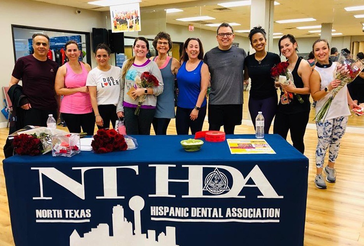 Dentist and dental team at North Texas Hispanic Dental Association event