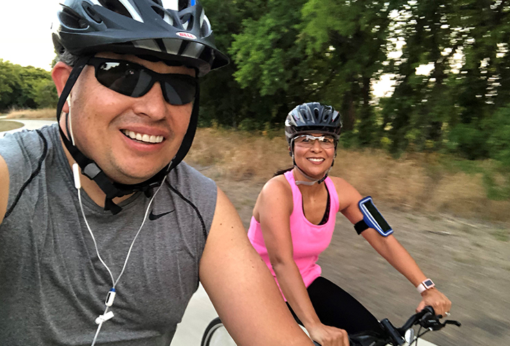 Dr. Caballeros and his wife at biking event