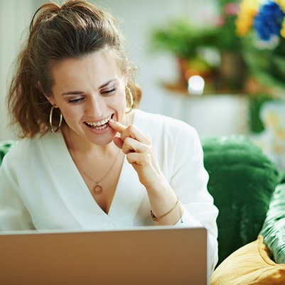 woman discussing the cost of cosmetic dentistry in Frisco