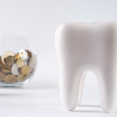Tooth by a pile of coins 