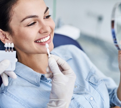 Smiling woman in consultation for dental bonding in Frisco