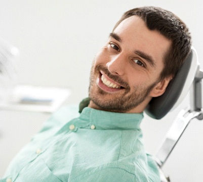 Man smiling at cosmetic dentist's office in Frisco