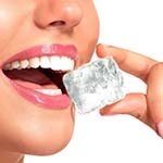 Woman chewing on ice at risk of chipped tooth in Carrollton