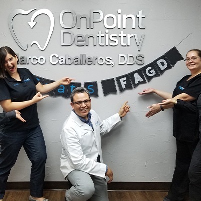 Dr. Caballeros and dental team celebrating his FAGD designation