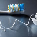 Closeup of toothbrush and floss