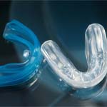 Closeup of blue and clear mouthguards