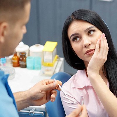 patient visiting dentist for implant failure