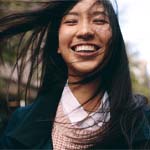 Laughing woman with dental implants in Frisco, TX