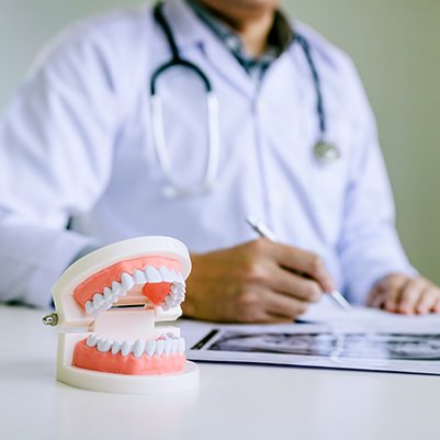 Dentist reviewing treatment plan and dental insurance coverage with patient