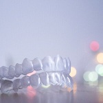 Closeup of mail-in aligners in Frisco on colorful background