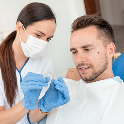 Man in dental chair getting Invisalign