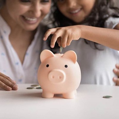 a piggy bank representing the cost of root canal therapy