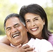 Man and woman with healthy smiles after dental checkup