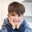 Young boy with healthy smile after children's dentistry appointment