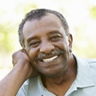 Man sharing flawless smile after tooth replacement