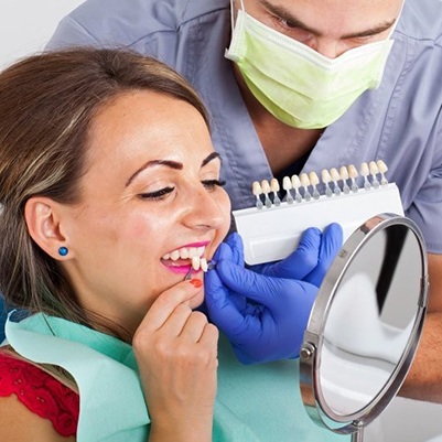 woman trying on porcelain veneers in Frisco