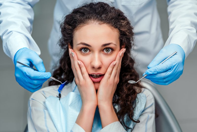 dental patient afraid of tooth extraction