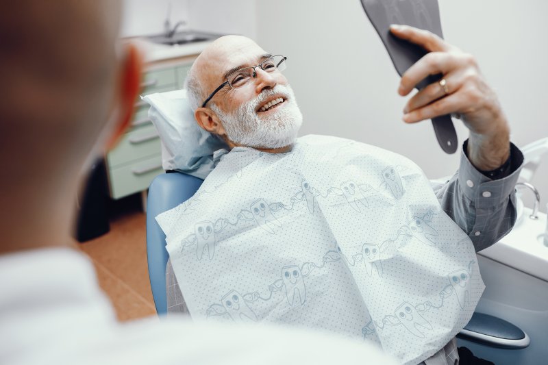 Man smiling at dentist