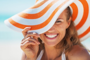 a patient smiling and enjoying the summer sun