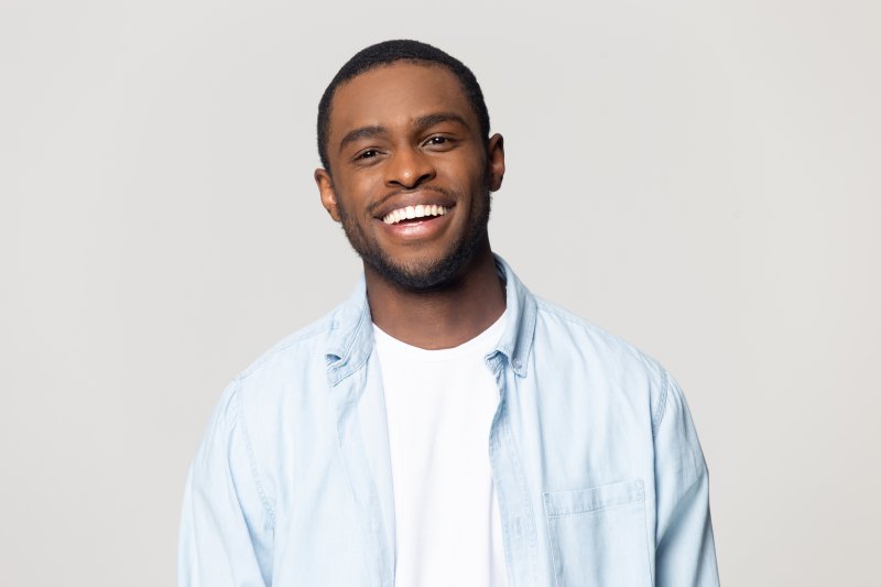 Man smiling with porcelain veneers